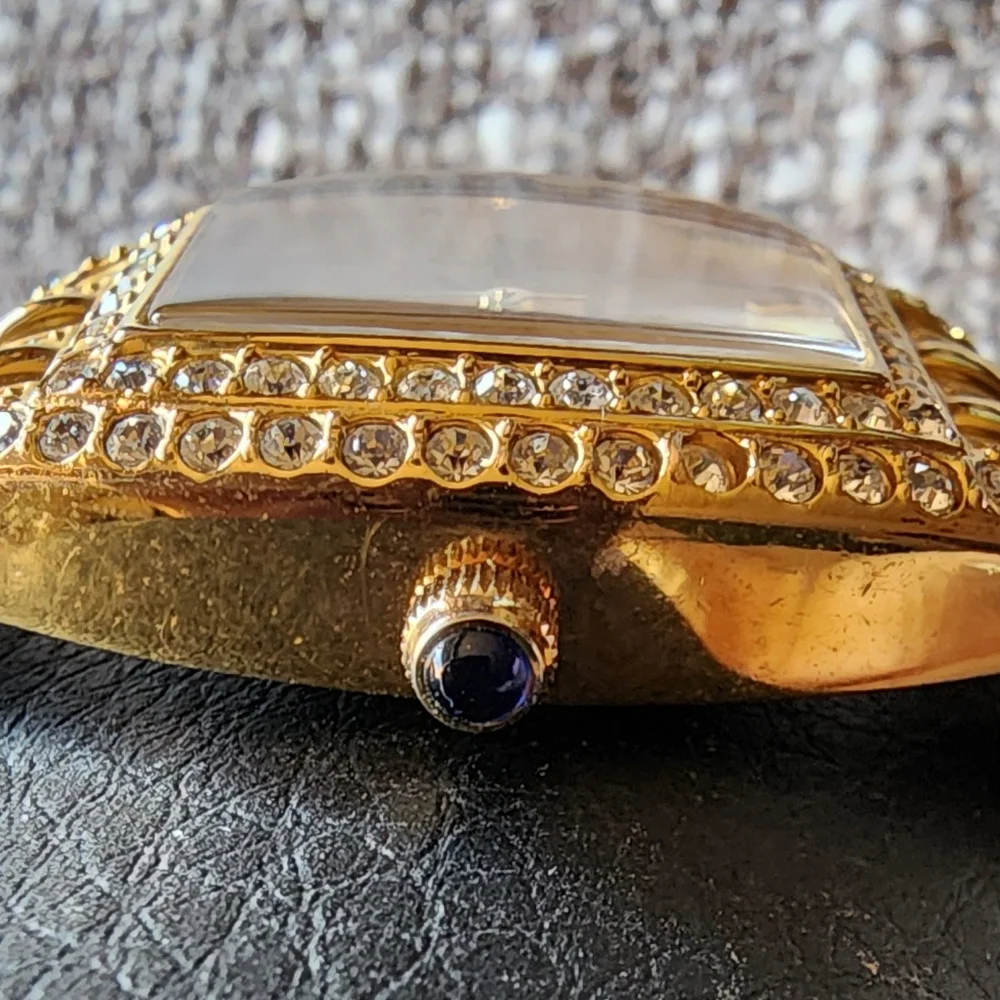 Vintage Nolan Miller crystal gold-tone watch.